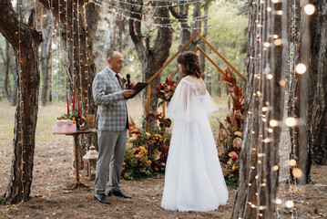 man and woman got engaged in autumn forest