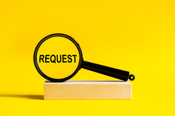 magnifying glass with text Request on wooden table