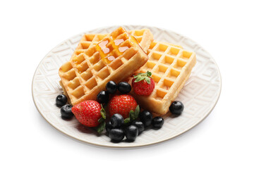 Plate of tasty Belgian Waffles with berries on white background