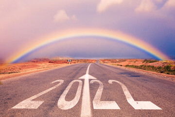 2022 New Year celebration - Numbers painted on the asphalt road under the rainbow