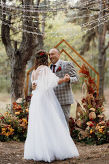 man and woman got engaged in autumn forest