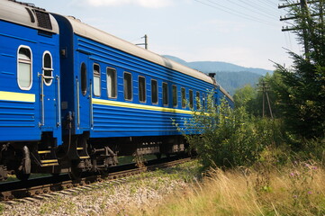 Blue carriage of a passenger train.