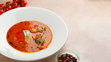 tom yum in white plate on concrete background. Spicy Thai food with ingredients on table. Spicy Thai food