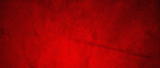 Red matte background of suede fabric, closeup. Velvet texture of seamless leather.