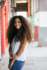 Portrait of a teenage cuban girl looking to the camera, closeup latin cuban teenage woman