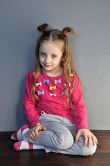 The little girl is European. Cute face. Joy and love. Poverty.