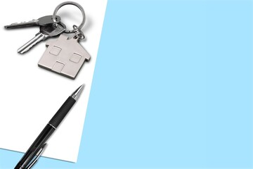 Keys and keychain on real estate document, contract agreement to buy or construction
