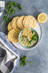 healthy dip with corn crackers. corianders and lemons
