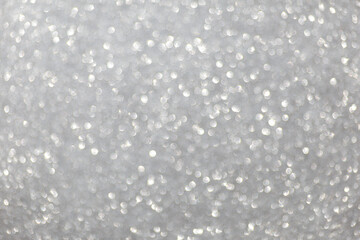Defocused christmas or party, grey glitter background with bokeh. Holiday glowing backdrop,banner...
