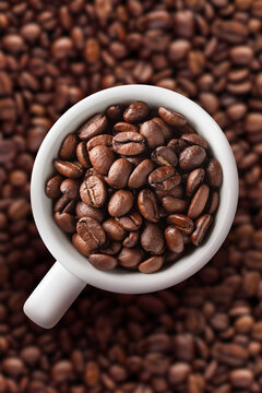 Coffee cup on beans background