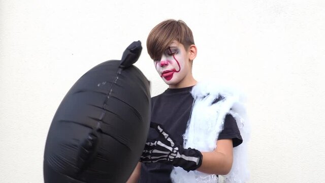 boy with make up of clown or scary for Halloween