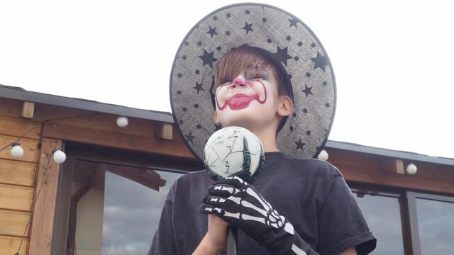 boy with Halloween costume, scary jocker or clown 