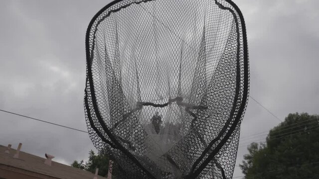 This video shows an interesting POV of the viewer being being captured by a large net.