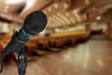Microphone On The Theater Stage with Blurred Lights