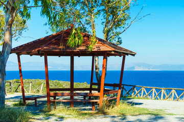 Benches under shelter in Greece near sea