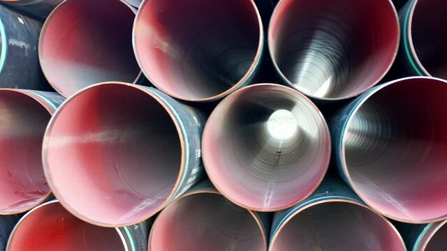 Stack of pipes for sewage or water supply system plumbing. Plastic or PVC or polythene tubes used for construction and installation of industrial drainage or distribution pipelines or sanitary sewer.
