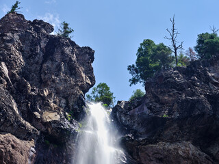 Treasure falls with moss covered rocks in Colorado