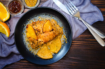 baked meat with oranges