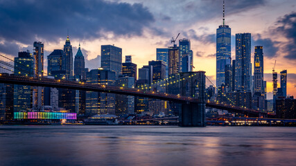 Naklejka na ściany i meble New York skyline view with Brooklyn bridge at sunset