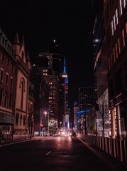 Obraz premium street New York city at night cars lights skyscrapers buildings traffic urban
