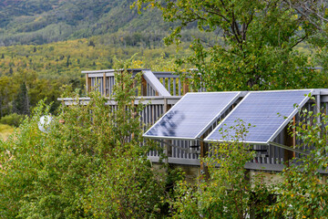 Solar panels in the fall landscape of Katmai National Park, Alaska
