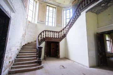 Bottom view of the wooden staircase in an old castle in light colors. High quality photo