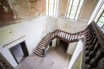 Top view of the wooden staircase in an old castle in light colors. High quality photo