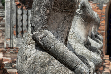 Aytthaya, Thailand, 22 Aug 2020 : Close-up of Ancient old buddha statue sculpture is damaged at the old temple in Ayuthaya province. thailand, Selective focus.