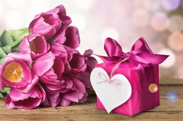 Fresh tulips flowers and gift or present box celebration concept.