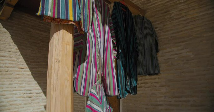 Bukhara, Uzbekistan bright national men's robes. Toki Zargaron trading dome.