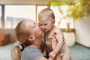 Young mom holding a cute small baby