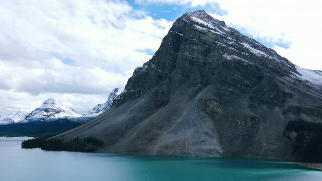 Banff National Park aerial view, flying over the Bow Lake in the Canadian Rockies during Fall, Alberta, Canada
Turquoise water in a mountain forest lake and Pine Forest Drone 4K Footage