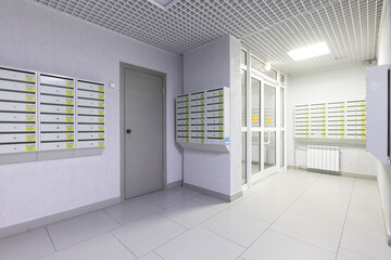 mailboxes in the lobby of an apartment building