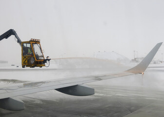 De-icing plane flying in arctic conditions