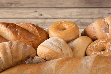 Fresh loaves of bread with wheat and gluten on a table
