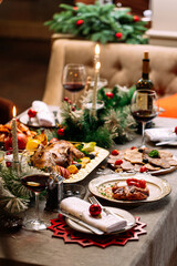 New Year festive served table with decorations and meal