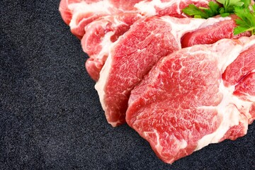 Variety of raw beef meat steaks for grilling with seasoning on the desk