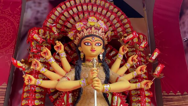 Close shot of devi durga clay idol inside pandal. Beautifully decorated maa Durga for the fetival in Kolkata.