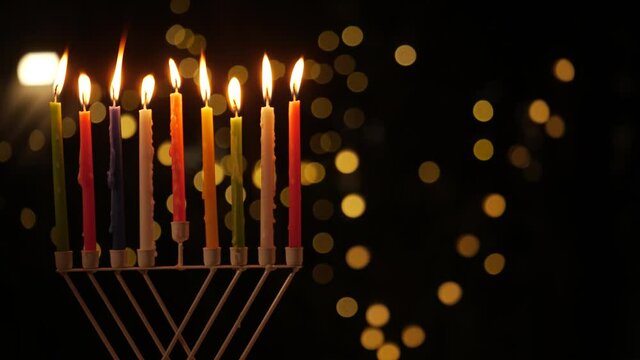kindle the Menorah candles Hanukkah holiday at night left screen 4k