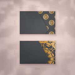 A presentable business card in black with antique gold ornaments for your personality.