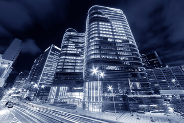 Modern office building in downtown of Hong Kong city at night