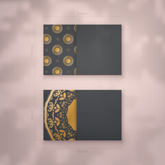 Business card template in black color with a luxurious gold pattern for your contacts.