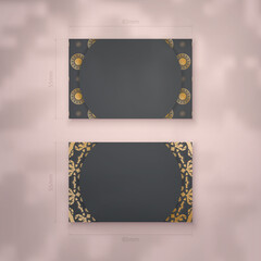 Black business card template with Indian gold ornaments for your personality.