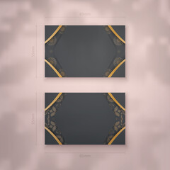 Business card template in black with abstract golden ornament for your personality.