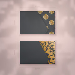 Black business card template with vintage gold pattern for your personality.