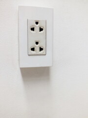 Electrical outlet switches on wall.