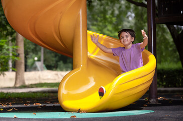 Little boy having fun while sliding.