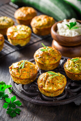 Homemade zucchini muffins with feta cheese and herbs