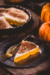 Homemade pumpkin pie with icing for Thanksgiving