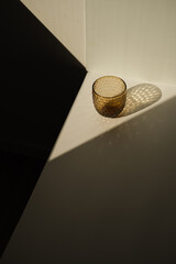 Minimal luxury aesthetic modern interior design concept. Crystal glass with sunlight shadow on the white wall background
